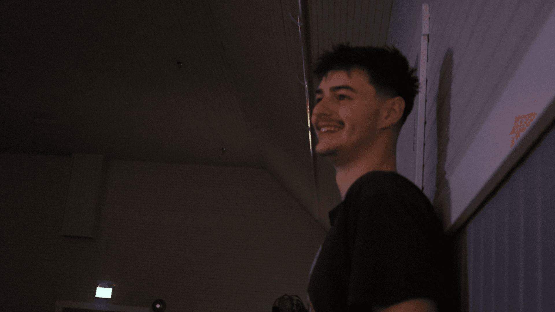 Ethan on the microphone, laughing